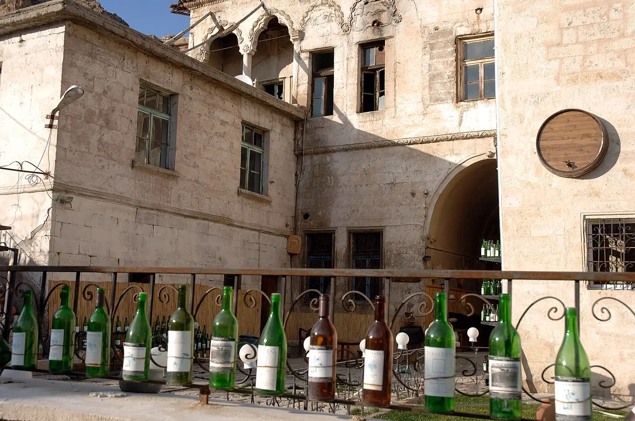 Wine bottles displayed along a railing at Mahzen winery in Ürgüp, Cappadocia.