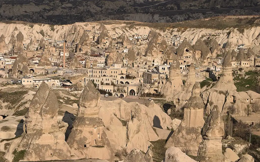 Rock formations and cave dwellings spread across Göreme Valley in Cappadocia.